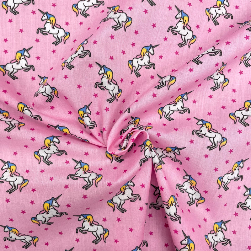 Unicorns Pink Polycotton Fabric | Width - 115cm/45inch - Shop Fabrics, Cushions & Dressmaking Supplies online - Fabric Family